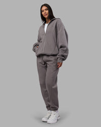 Woman wearing Stream Panel Track Pants - Storm Front | Model:Rhiley | Size:S