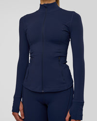 Woman wearing Stride Zip Through Jacket - Future Navy | Model:Evie | Size:S