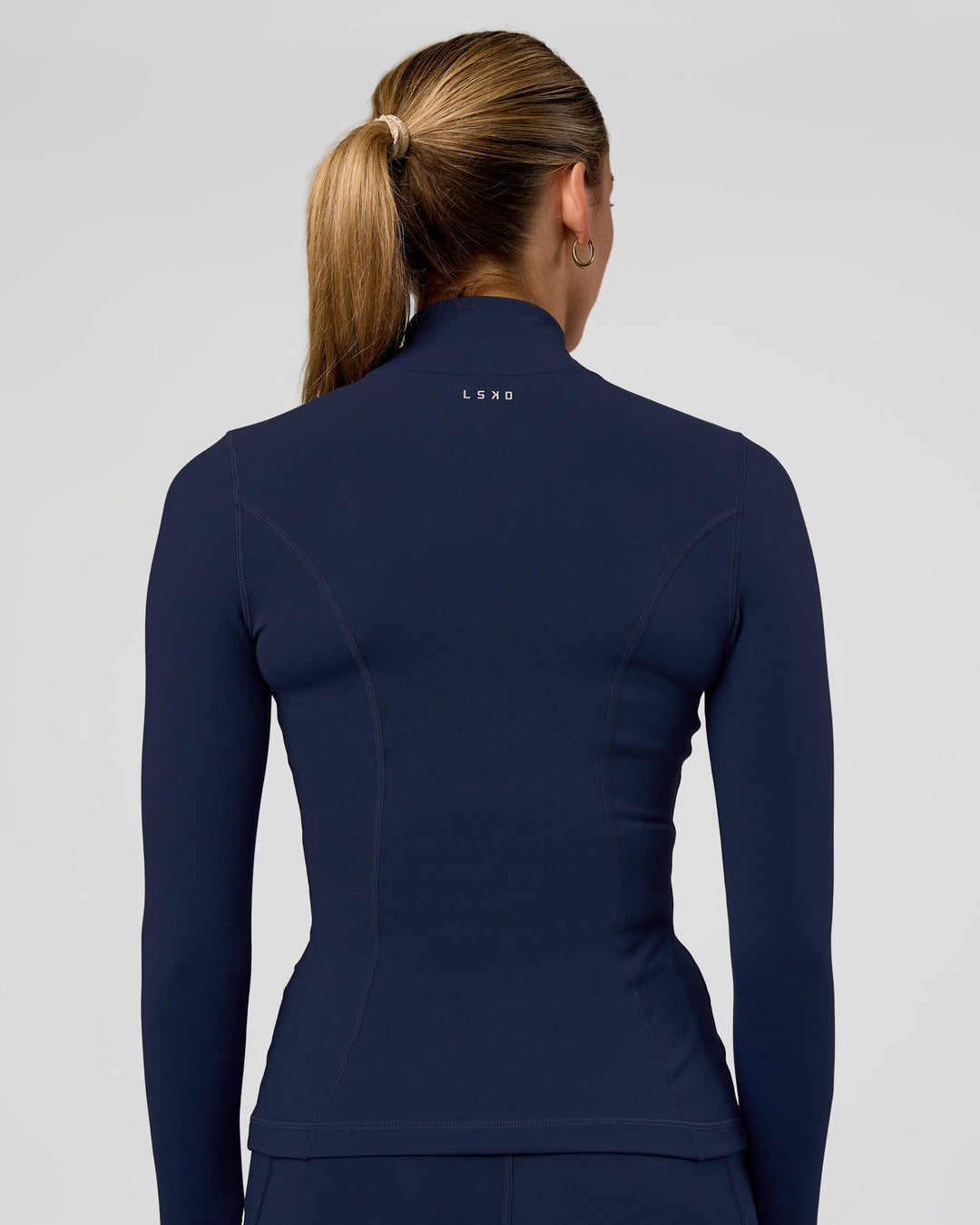 Woman wearing Stride Zip Through Jacket - Future Navy | Model:Evie | Size:S