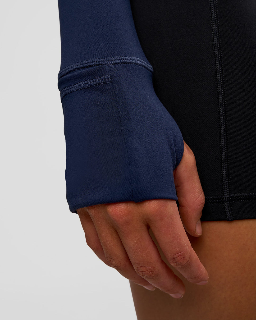 Woman wearing Stride Zip Through Jacket - Future Navy | Model:Evie | Size:S