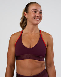 Woman wearing Strive Jacquard Sports Bra - Cherry Lacquer | Model:Sav | Size:S | Thumbnail Index: 2