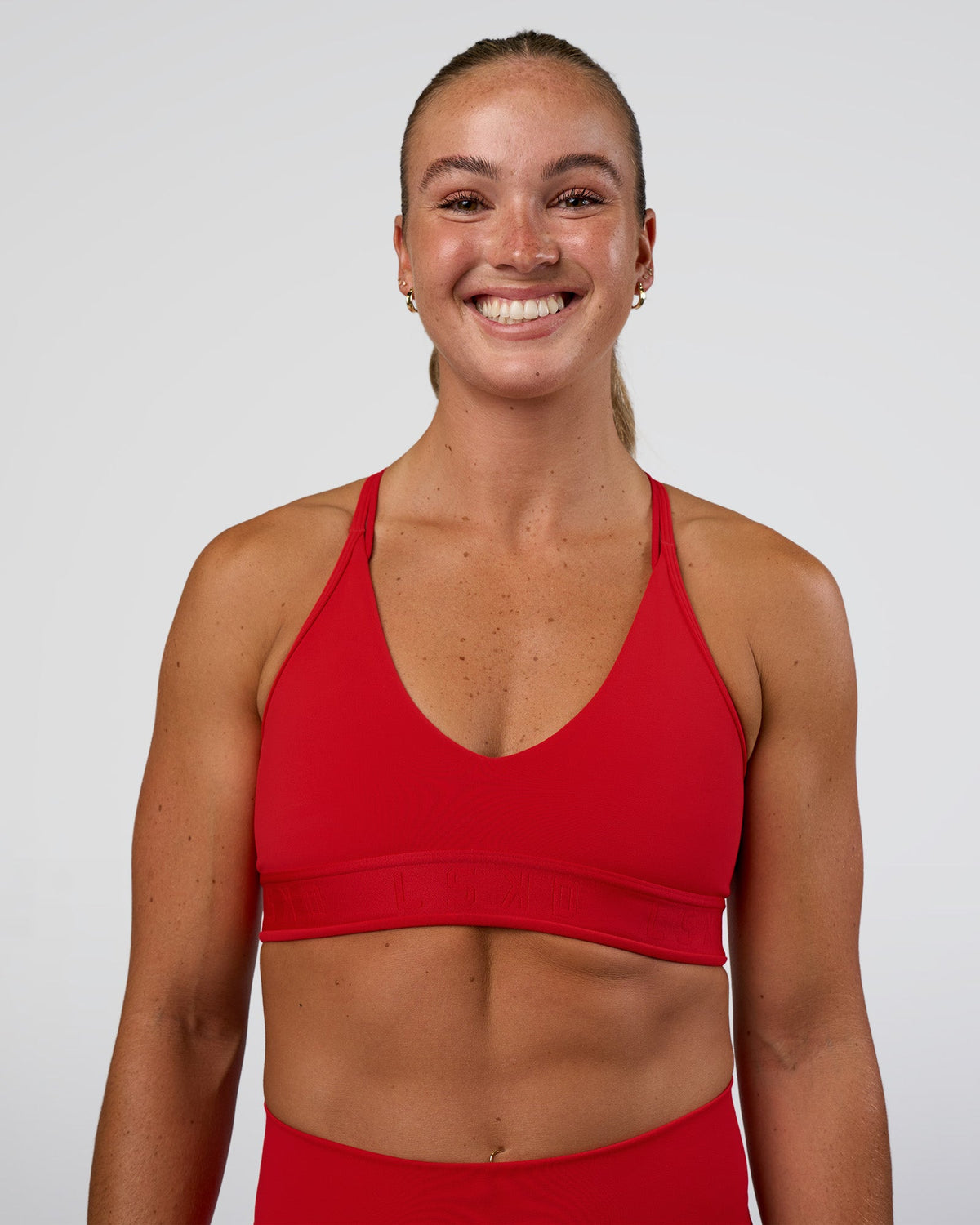 Woman wearing Strive Jacquard Sports Bra - Flame | Model:Sav | Size:S - view 2