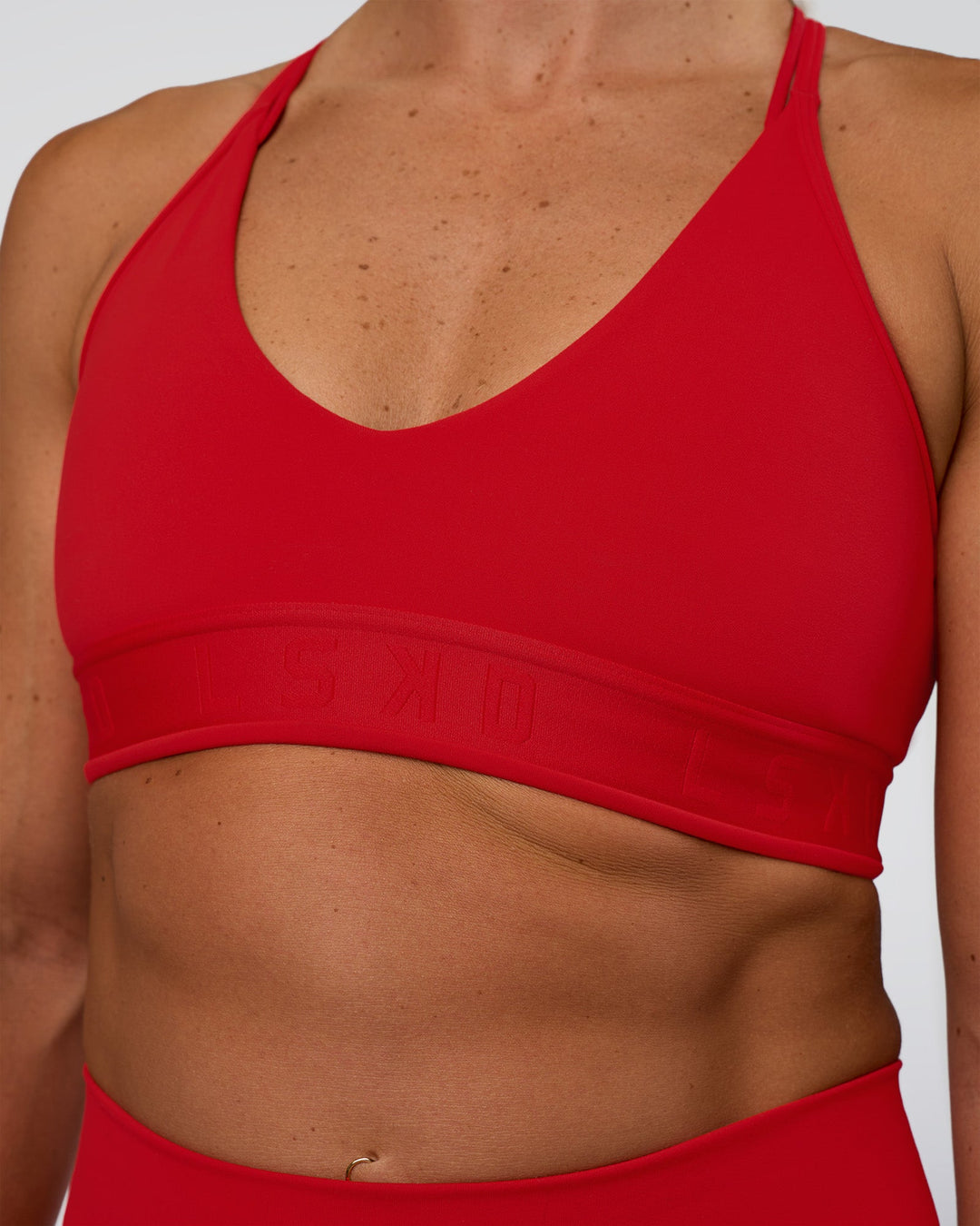 Woman wearing Strive Jacquard Sports Bra - Flame | Model:Sav | Size:S - view 4
