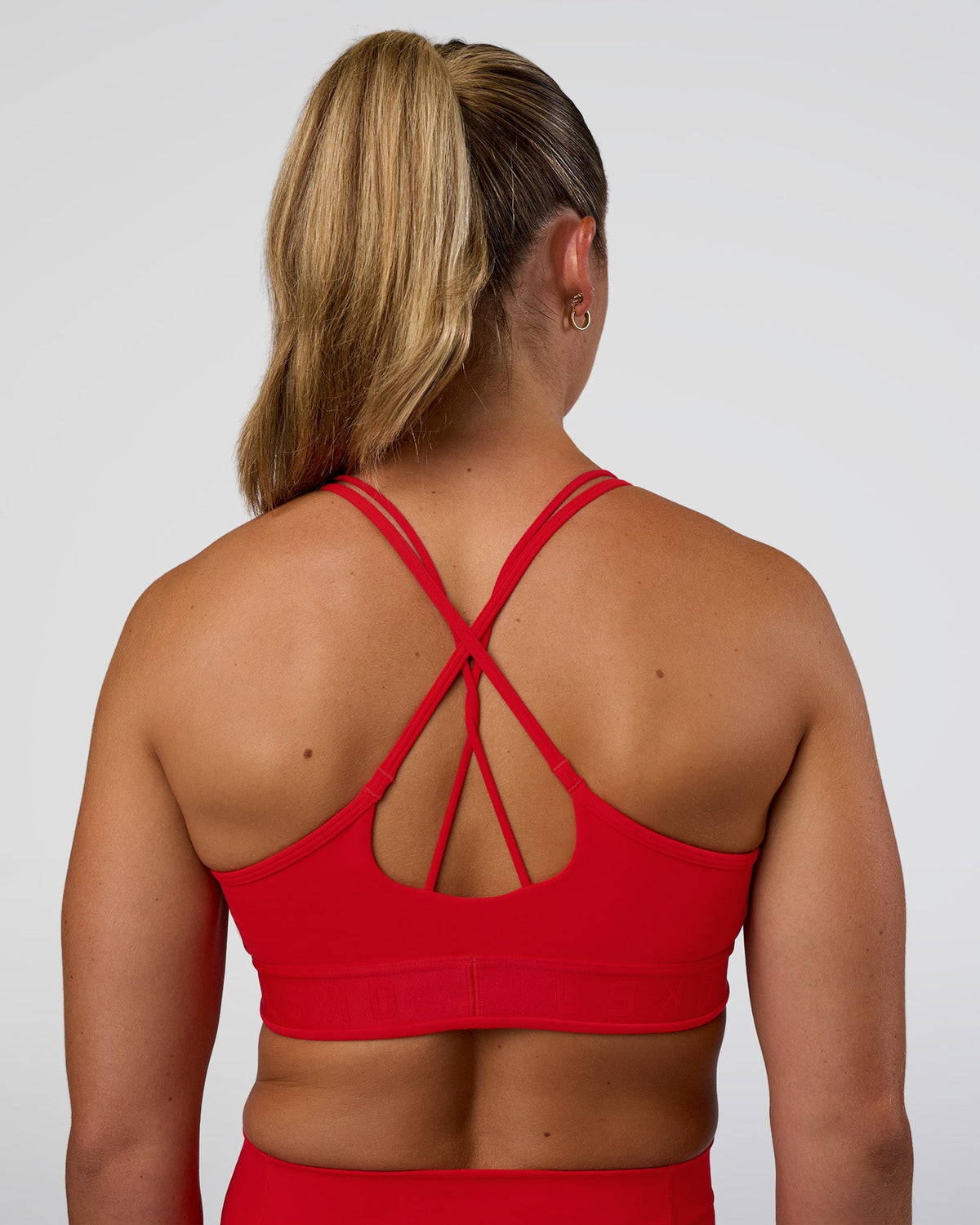 Woman wearing Strive Jacquard Sports Bra - Flame | Model:Sav | Size:S - view 1