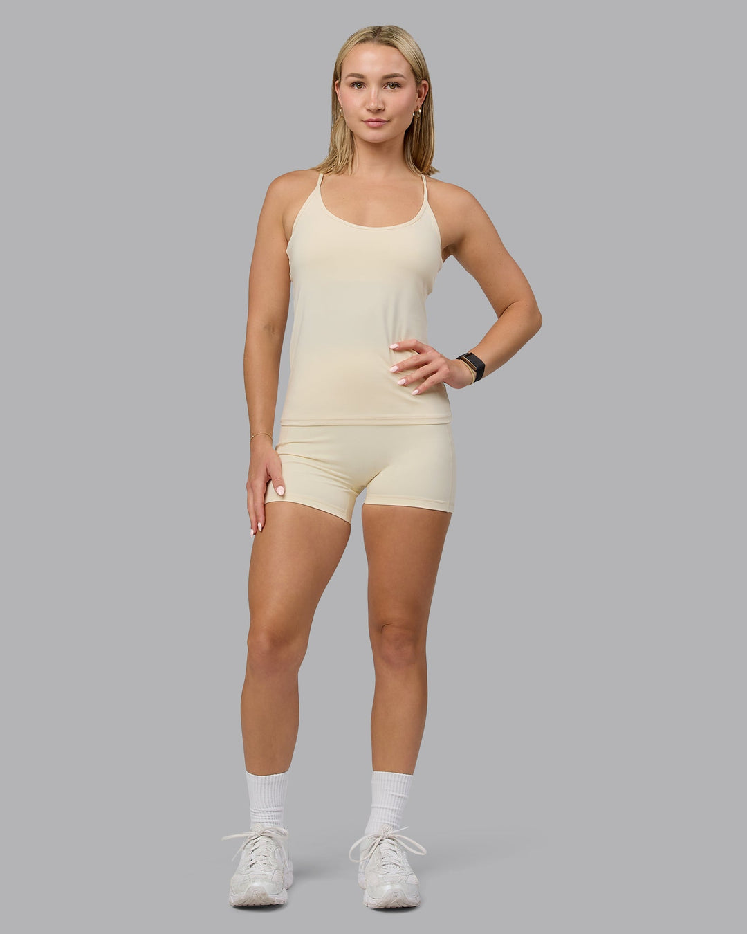 Woman wearing Transition CloudFLX Shelf Bra Tank - Ivory