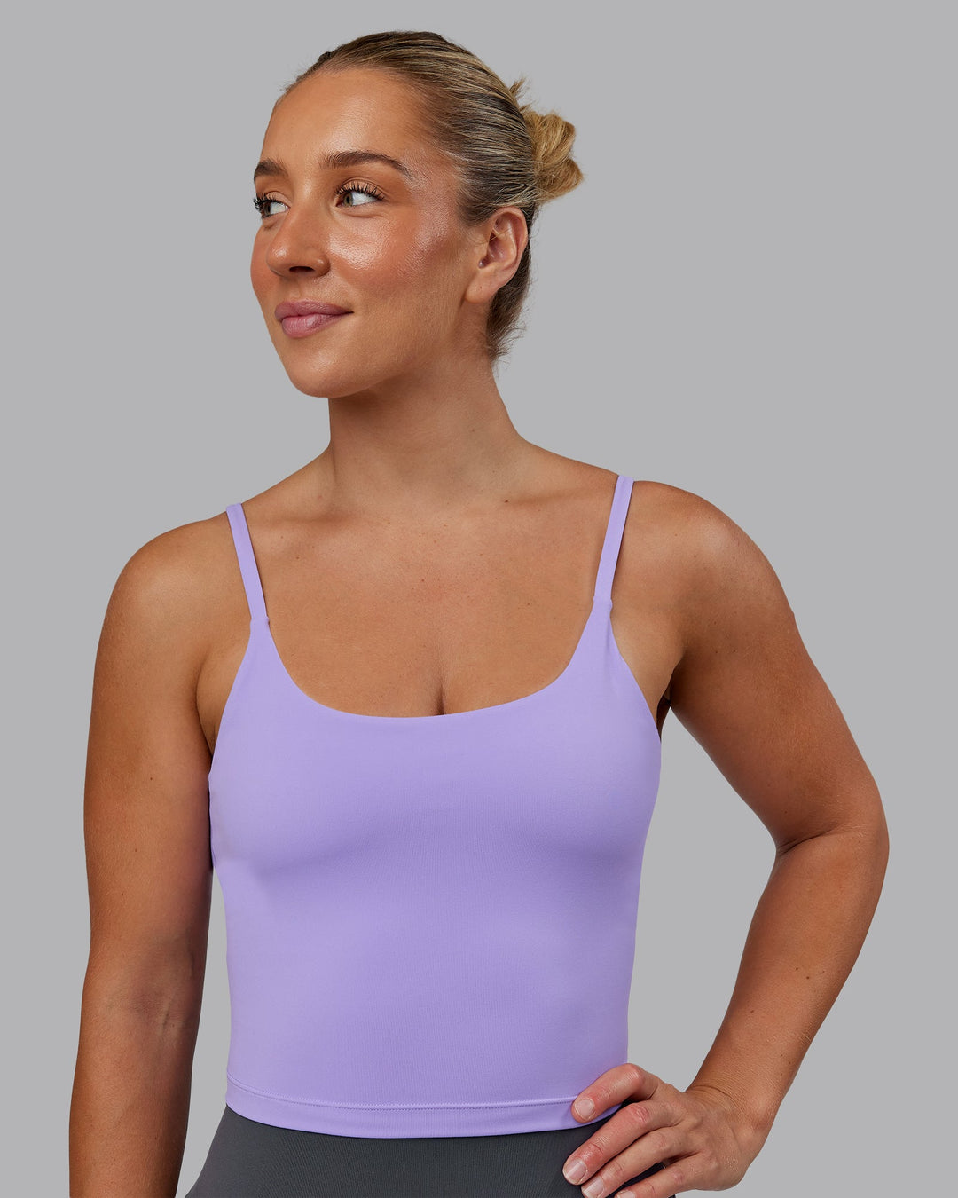 Woman wearing Twist Shelf Bra Tank in Violet Ray | Size:S