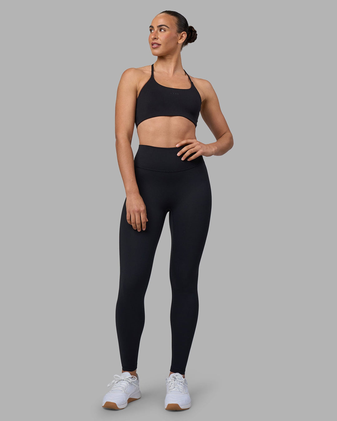 Woman wearing Twist Sports Bra - Black | Model:Sophie | Size:S - view 4