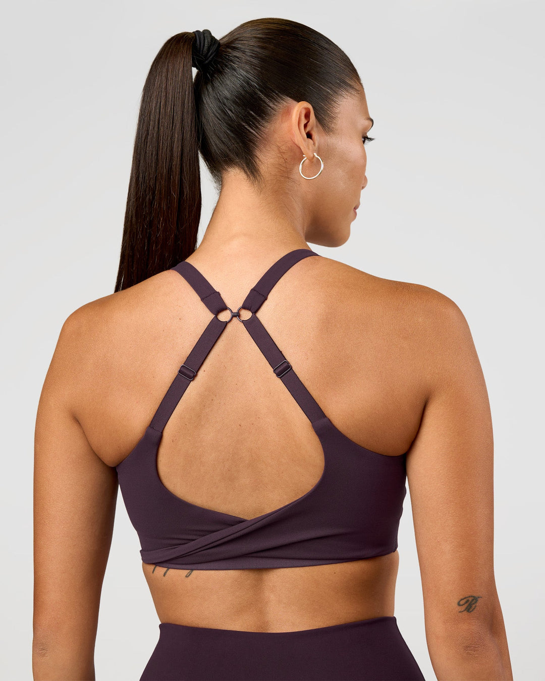 Woman wearing Twist Sports Bra D/DD/E - Midnight Plum | Model:Rhiley | Size:S - view 2