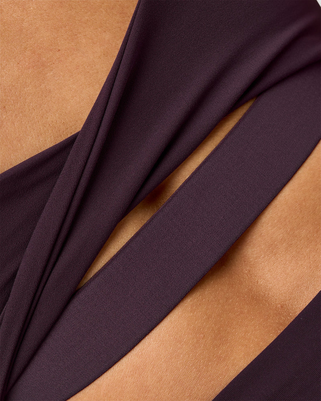 Woman wearing Twist Sports Bra D/DD/E - Midnight Plum | Model:Rhiley | Size:S