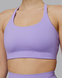 Woman wearing Twist Sports Bra D/DD/E - Violet Ray | Model:Lillie | Size:S