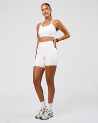 Woman wearing Twist Sports Bra D/DD/E - White | Model:Rhiley | Size:S | Thumbnail Index: 5