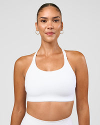 Woman wearing Twist Sports Bra D/DD/E - White | Model:Rhiley | Size:S | Thumbnail Index: 2