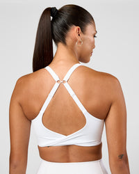 Woman wearing Twist Sports Bra D/DD/E - White | Model:Rhiley | Size:S | Thumbnail Index: 0