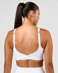 Woman wearing Twist Sports Bra D/DD/E - White | Model:Rhiley | Size:S | Thumbnail Index: 3