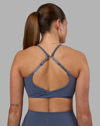 Woman wearing Twist Sports Bra - Night Shadow | Model:Phoebe | Size:S