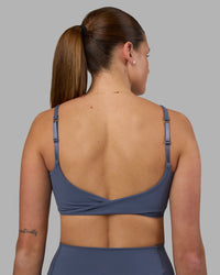 Woman wearing Twist Sports Bra - Night Shadow | Model:Phoebe | Size:S