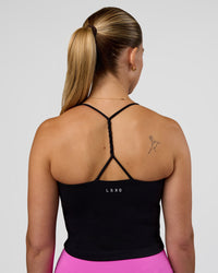 Woman wearing Twister Shelf Bra Tank - Black | Model:Myrte | Size:S | Thumbnail Index: 4