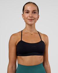 Woman wearing Twister Sports Bra - Black  | Model:Myrte | Size:S | Thumbnail Index: 1