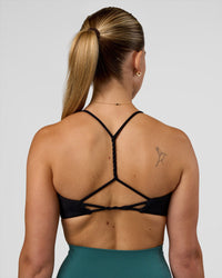 Woman wearing Twister Sports Bra - Black  | Model:Myrte | Size:S | Thumbnail Index: 5