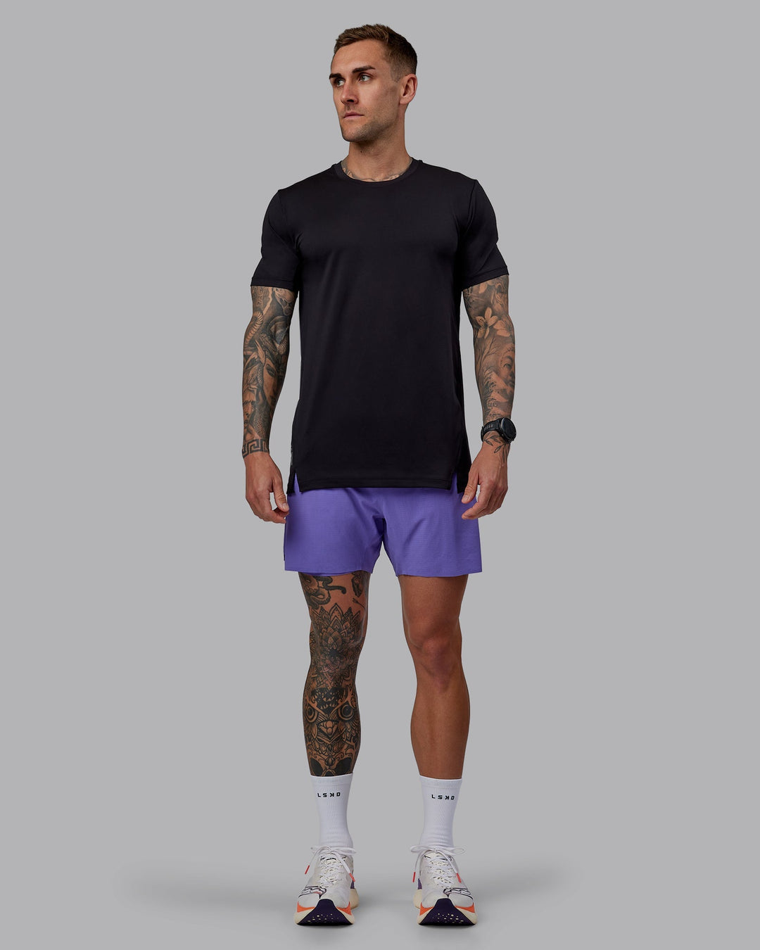 Man wearing UltraAir 5&quot; Lined Performance Shorts - Dahlia Purple