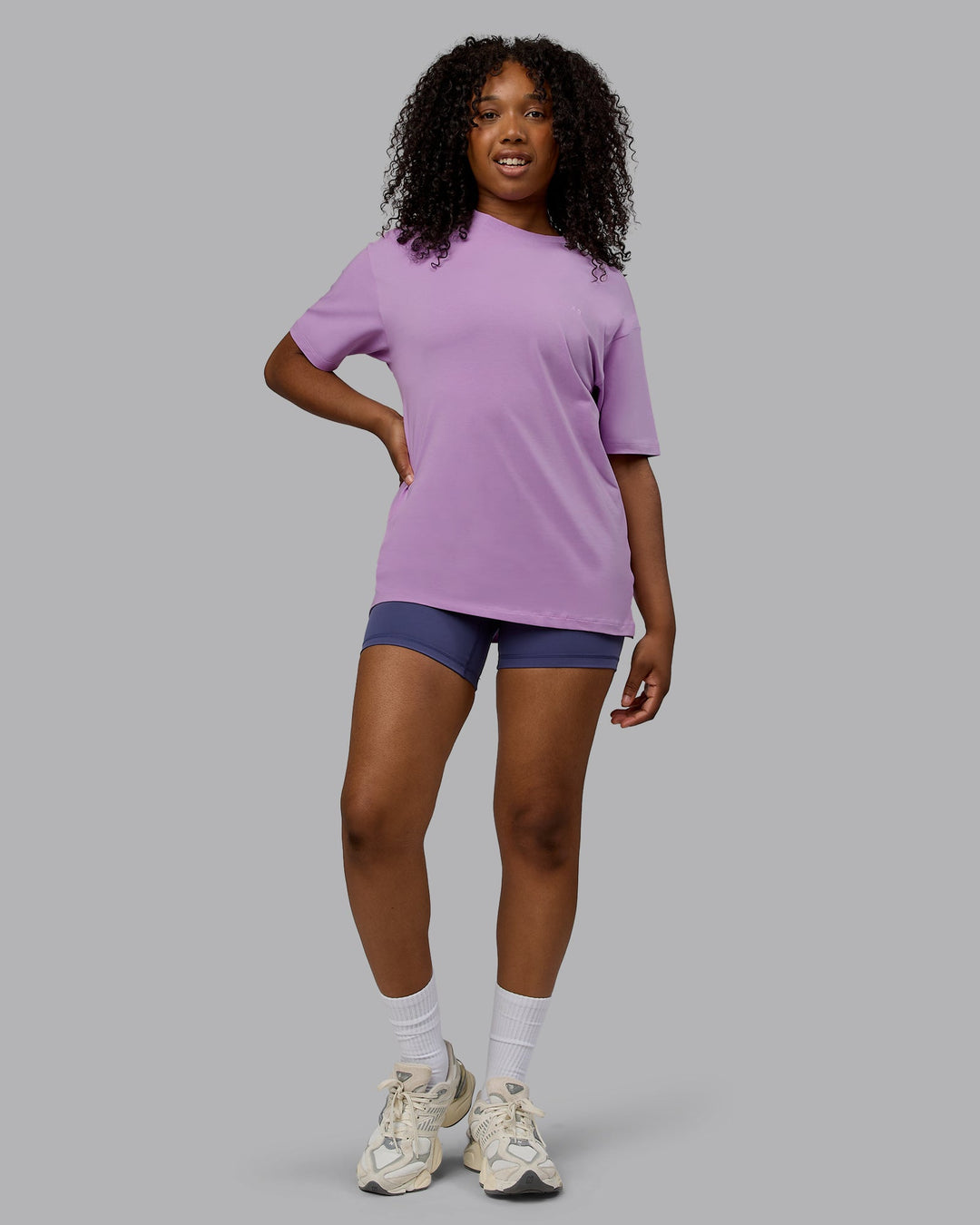 Woman wearing Unisex Deluxe PimaFLX Tee Oversize - Light Violet