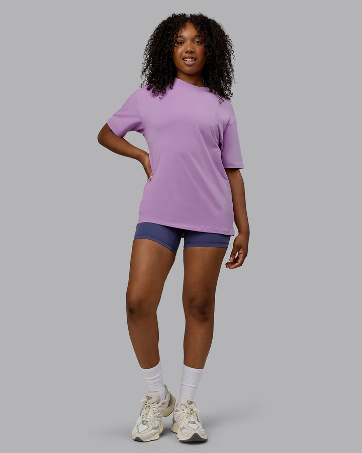 Woman wearing Unisex Deluxe PimaFLX Tee Oversize - Light Violet
