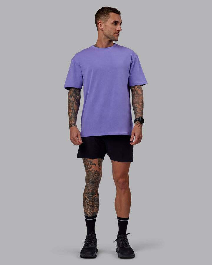 Man wearing Unisex Keep On Running FLXCotton Tee Oversize - Dahlia Purple
