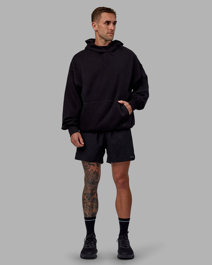 Man wearing Unisex Keep on Running Hoodie Oversize - Black-White
