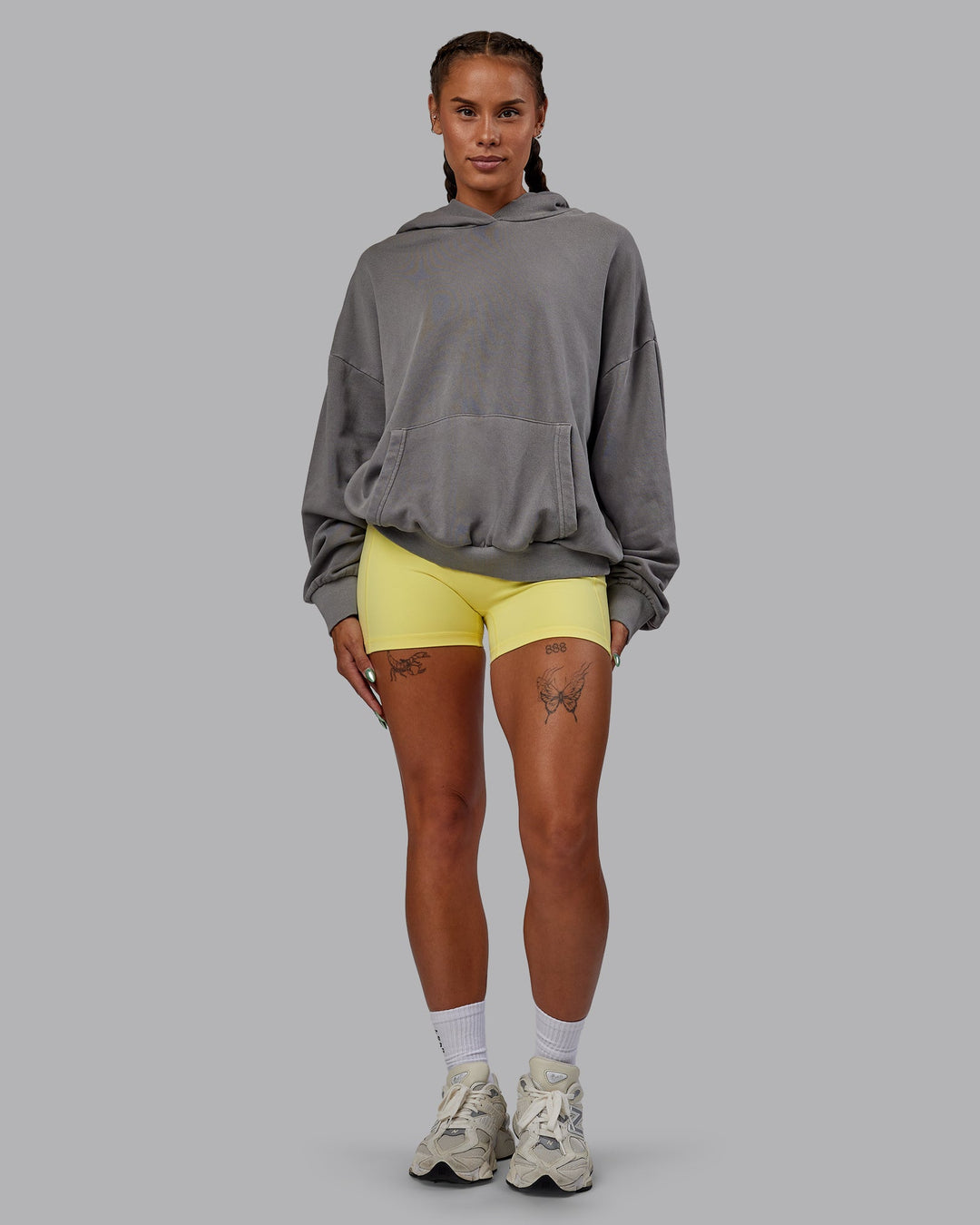 Woman wearing Unisex Miami25 Washed Hoodie Oversize - Storm Front