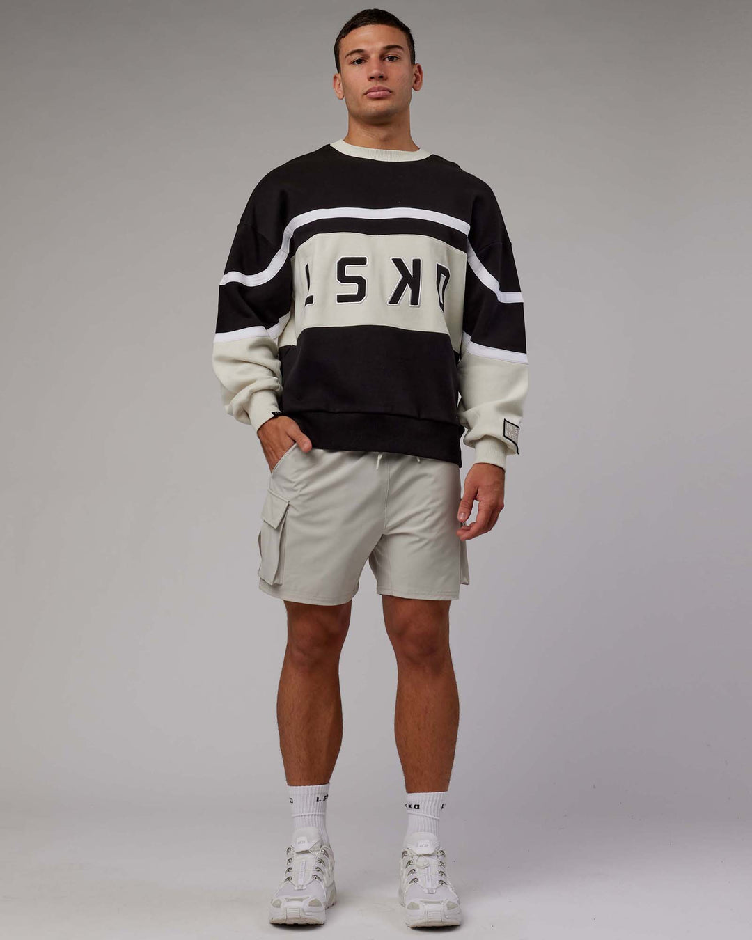 Man wearing Unisex PrimeTime Sweater Oversize - Black-Bone