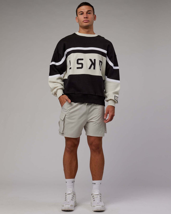 Man wearing Unisex PrimeTime Sweater Oversize - Black-Bone
