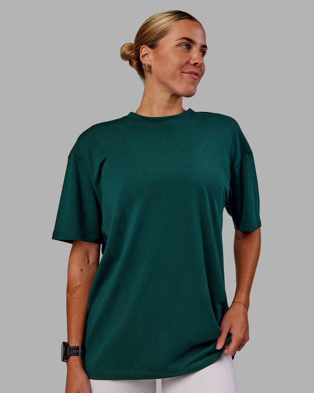 Woman wearing Variation FLXCotton Oversized Tee in Dark Moss-Digital Mist | Size:S