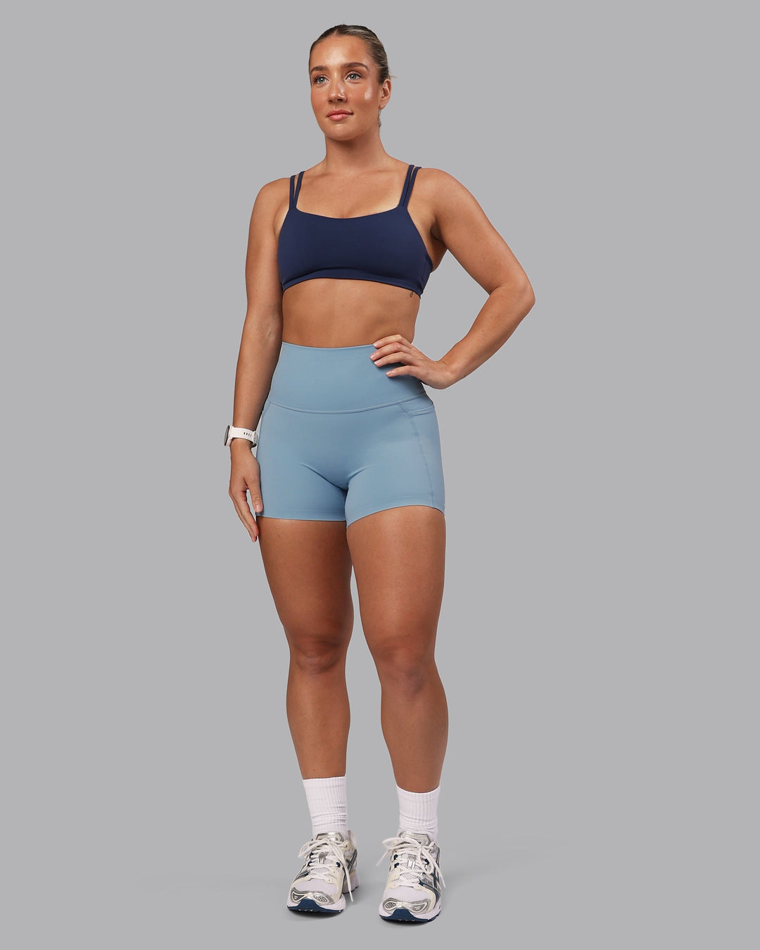 Woman wearing Vantage Sports Bra - Future Navy