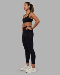 Woman wearing Velocity Sports Bra - Black | Model:Vanessa | Size:S