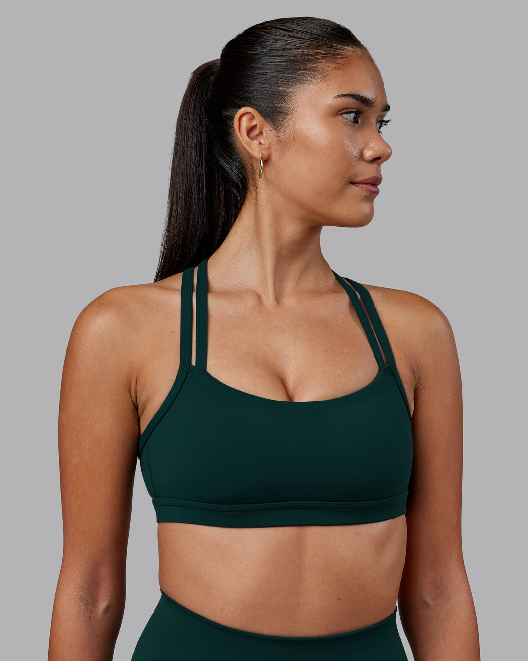 Woman wearing Velocity Sports Bra - Dark Moss | Model:Rhiley | Size:S