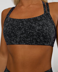 Woman wearing Velocity Sports Bra - Energy Print Black | Model:Amity | Size:S | Thumbnail Index: 3