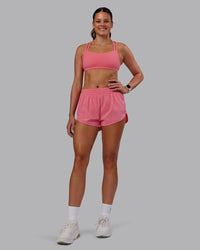 Woman wearing Velocity Sports Bra in Pink Lemonade | Model:Phoebe | Size:S