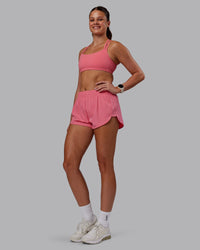 Woman wearing Velocity Sports Bra in Pink Lemonade | Model:Phoebe | Size:S