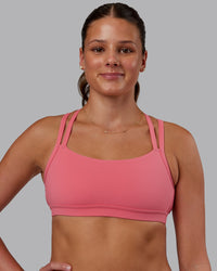 Woman wearing Velocity Sports Bra in Pink Lemonade | Model:Phoebe | Size:S