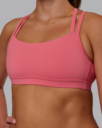 Woman wearing Velocity Sports Bra in Pink Lemonade | Model:Phoebe | Size:S