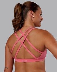 Woman wearing Velocity Sports Bra in Pink Lemonade | Model:Phoebe | Size:S