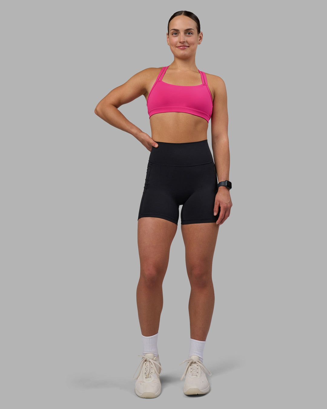 Woman wearing Velocity Sports Bra - Ultra Pink | Model:Keisha | Size:S