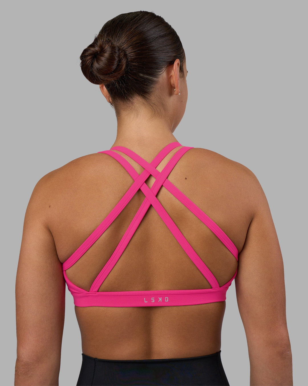 Woman wearing Velocity Sports Bra - Ultra Pink | Model:Keisha | Size:S