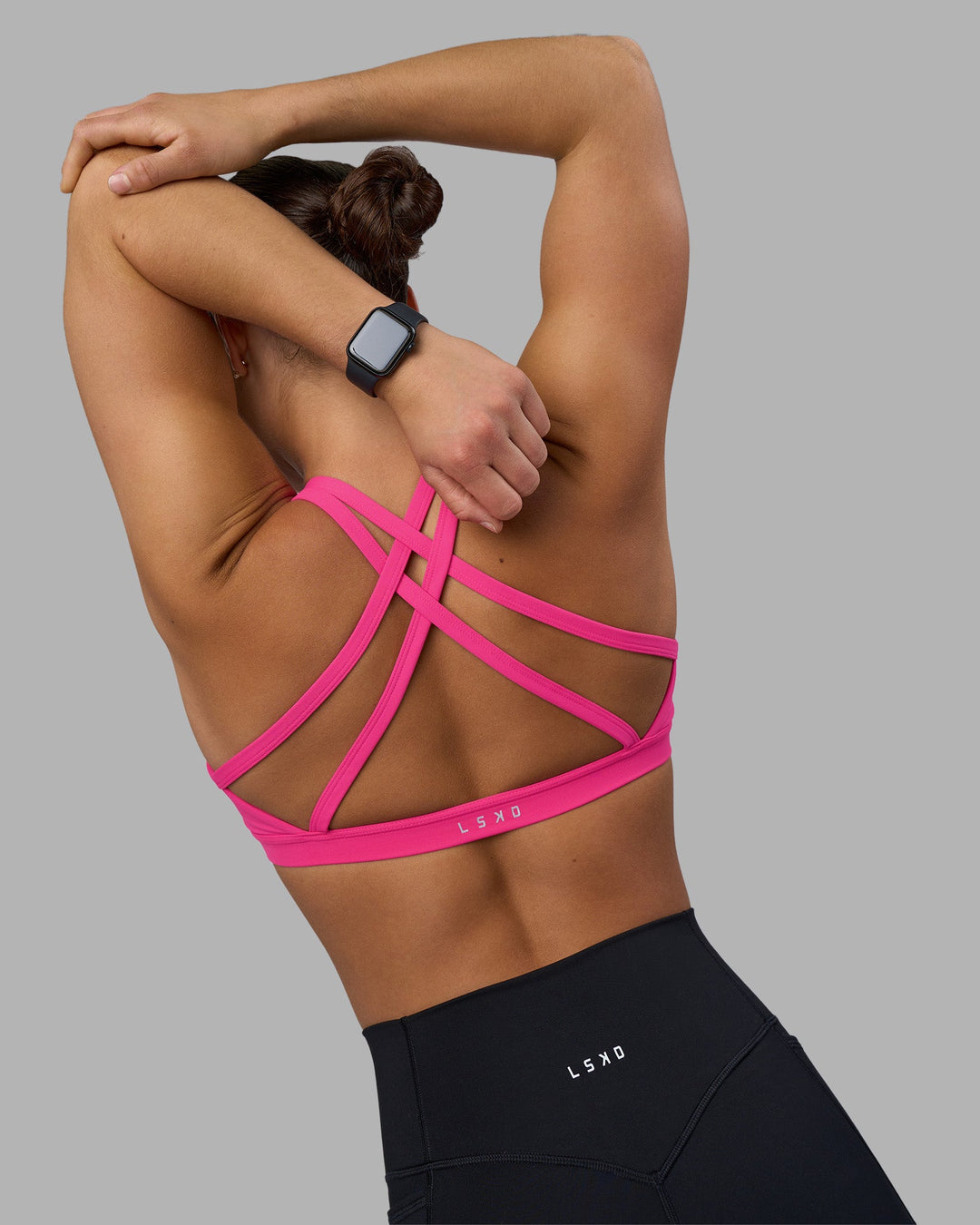 Woman wearing Velocity Sports Bra - Ultra Pink | Model:Keisha | Size:S