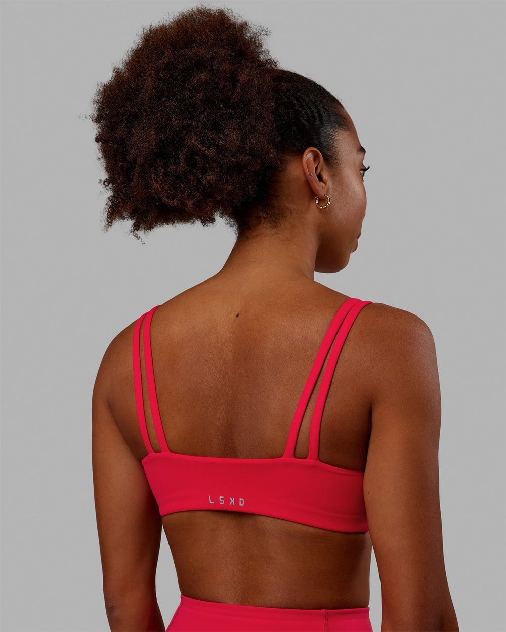 Woman wearing Vogue Sports Bra - Scarlet