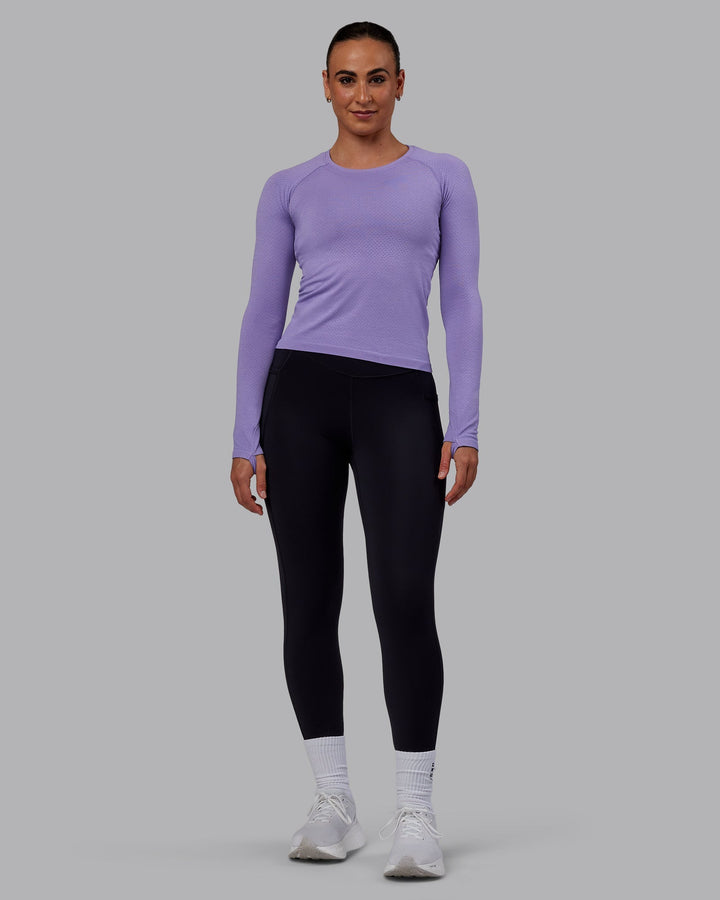 Woman wearing AeroFLX+ Seamless Long Sleeve Tee - Dahlia Purple Marl
