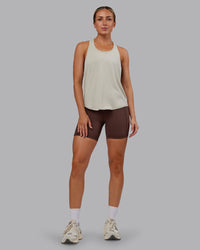 Woman wearing AeroFLX+ Drop Armhole Seamless Tank - Shale Beige | Model:Paris | Size:S | Thumbnail Index: 7