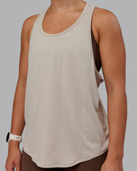 Woman wearing AeroFLX+ Drop Armhole Seamless Tank - Shale Beige | Model:Lyss | Size:S | Thumbnail Index: 2
