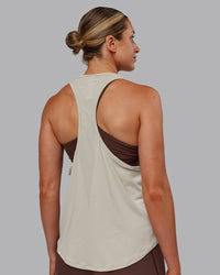 Woman wearing AeroFLX+ Drop Armhole Seamless Tank - Shale Beige | Model:Paris | Size:S | Thumbnail Index: 4