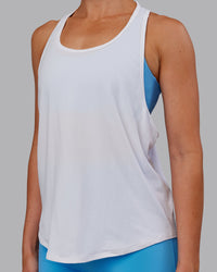 Woman wearing AeroFLX+ Drop Armhole Seamless Tank - White | Model:Paris | Size:S | Thumbnail Index: 2